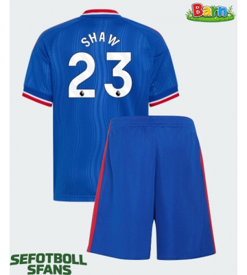 Manchester United Luke Shaw #23 Bortaställ Barn 2026-27 Kortärmad (+ Korta byxor)